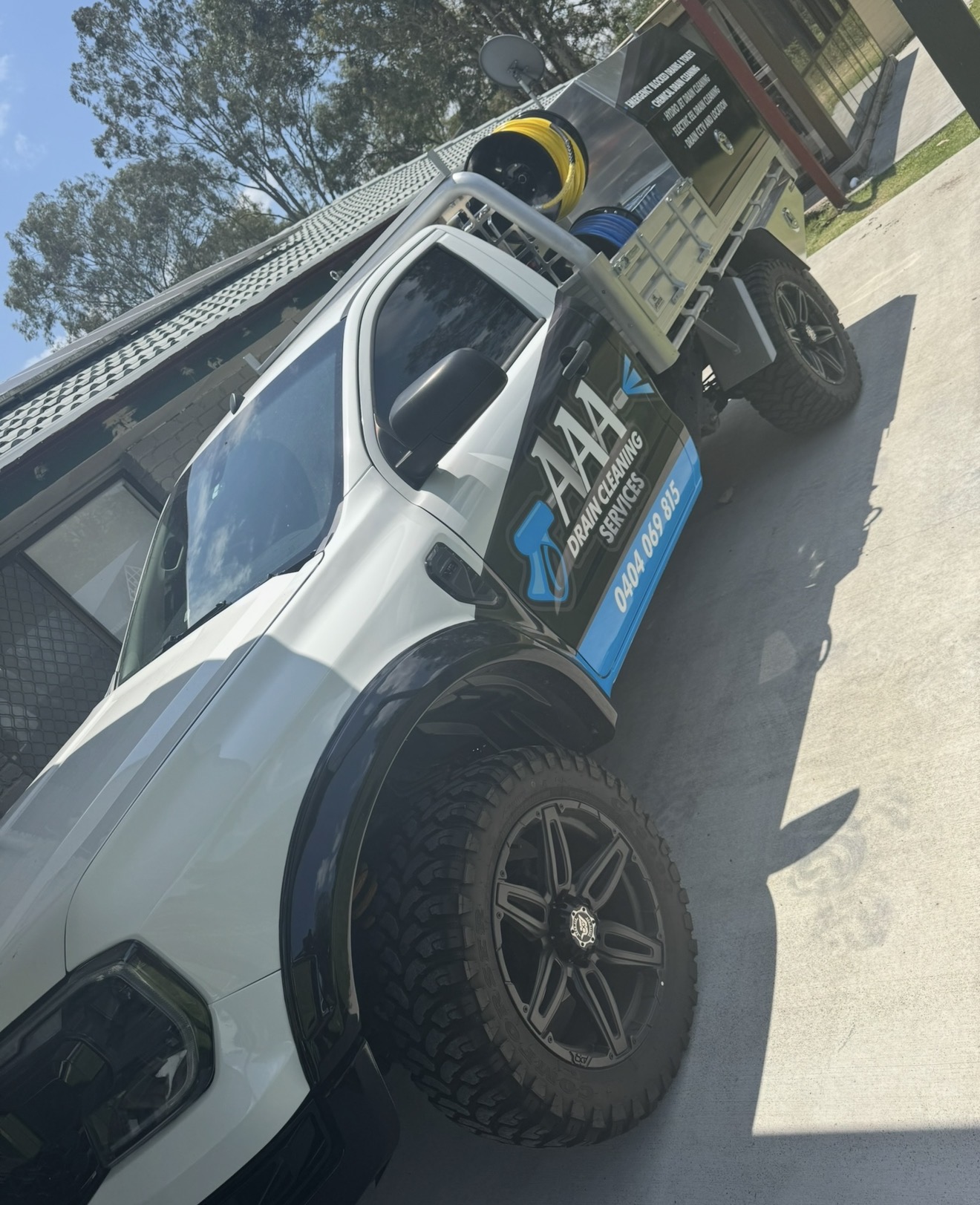 AAA Drain Cleaning Services branded ute carrying drain jetting, eel and CCTV equipment